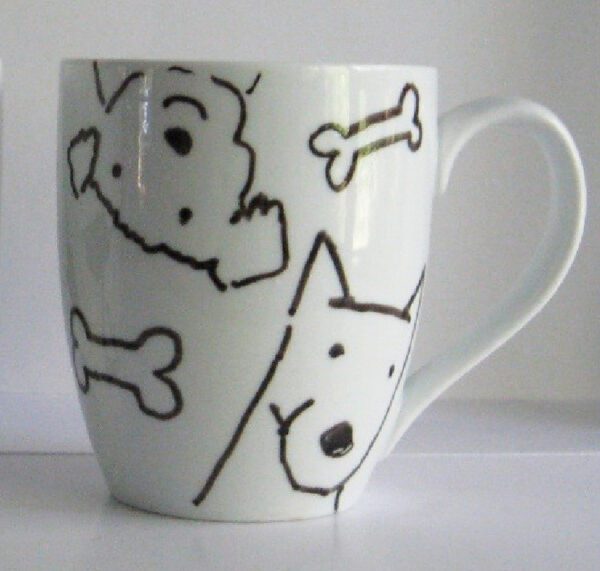 A Mugs - Dog Lovers with a drawing of dogs and bones.