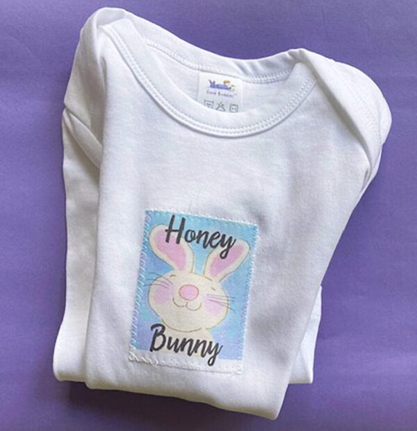 A white t-shirt with an image of a bunny.