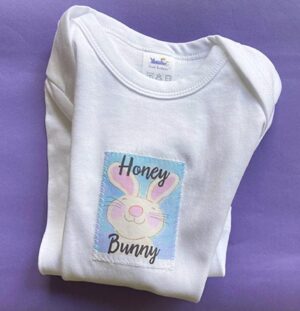A white t-shirt with an image of a bunny.
