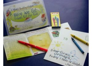 Paper from travel kit with crayons and pens