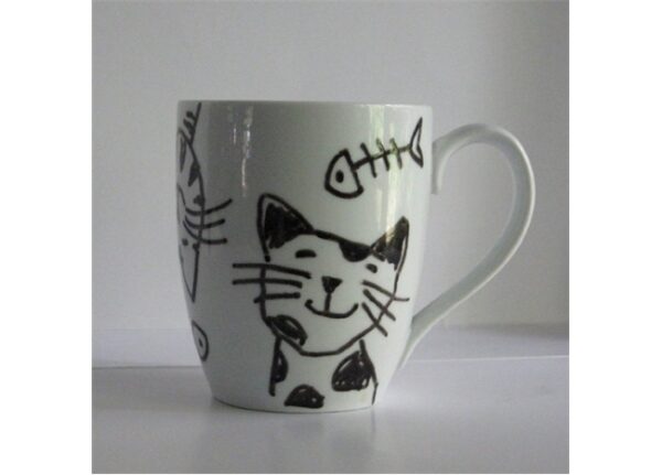 A black and white Mugs - Cat Lover with a drawing of a cat and fish.
