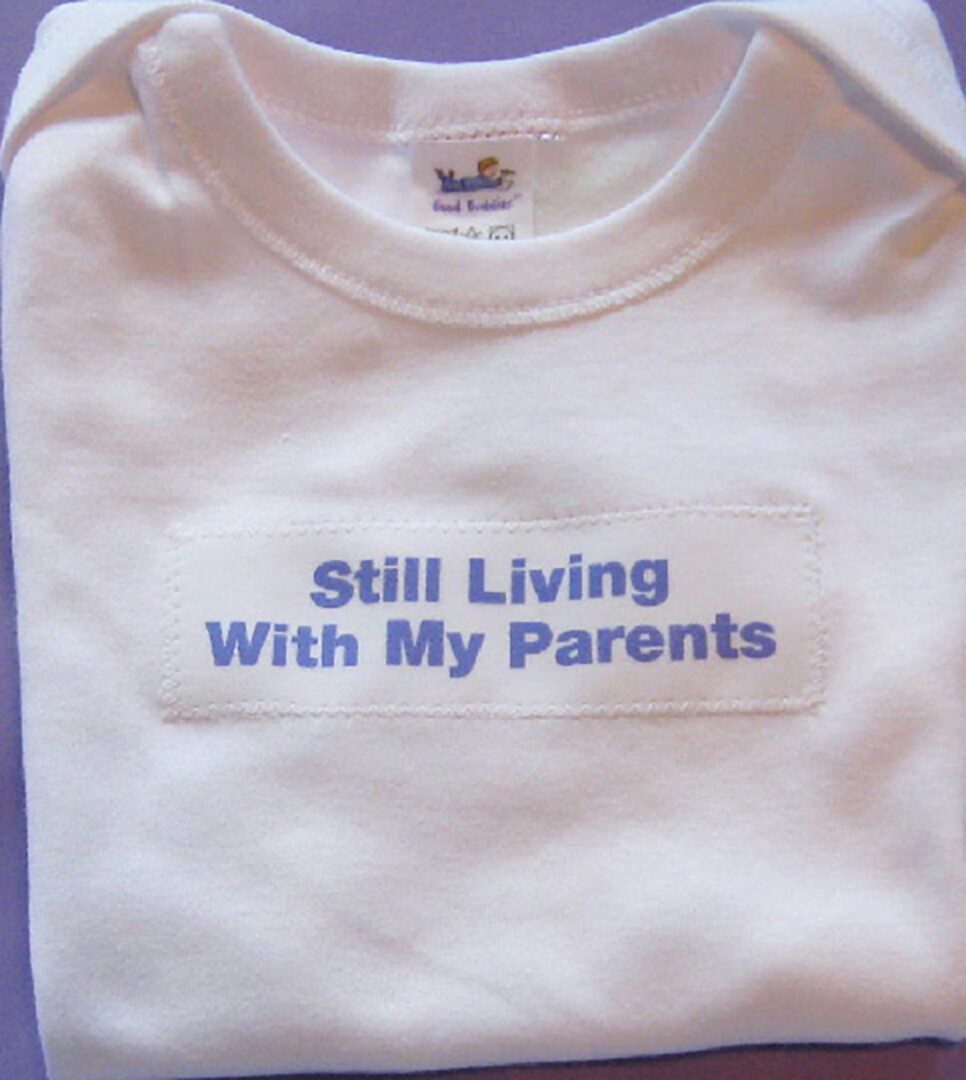 A white shirt with the words " still living with my parents ".