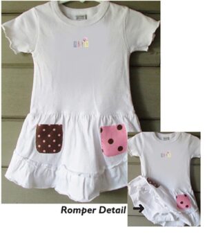 A white dress with pink and brown polka dots.