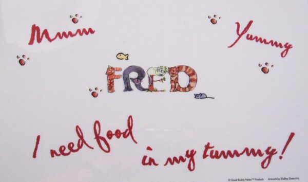 A white board with the name fred written in letters.
