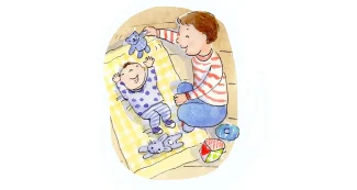 A child is playing with his teddy bear.